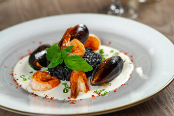 seafood, mussels, salmon on a white plate