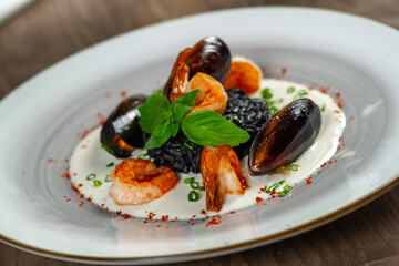 seafood, mussels, salmon on a white plate