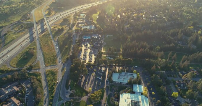 Aerial: Flying over Sandhill Road and the 280 Freeway, home of venture capital firms. Menlo Park, Silicon Valley. 