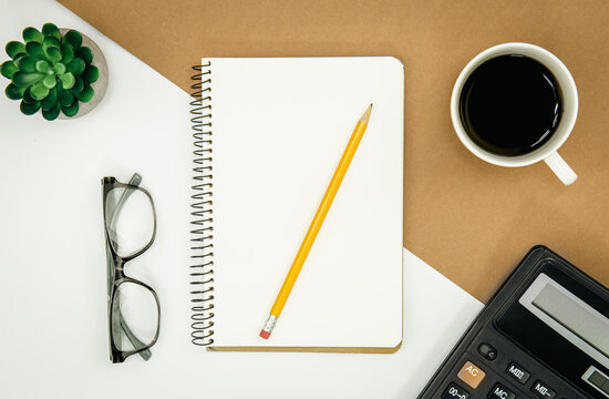 Flat lay, notepad, calculator and coffee cup, office concept.