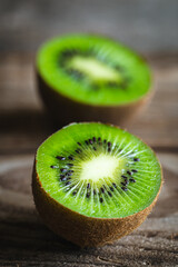 Close -up, cut fruit kiwi on a wooden background.