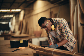 Fototapeta na wymiar Carpenter man attend to making masterpiece woodworks handcrafted furniture fine measure in wood workshop.