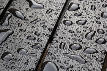 abstract background drops of rain water on a wooden table