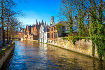 Historic medieval buildings along a canal in Bruges, Belgium