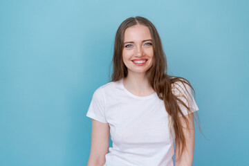 Portrait happy modern woman, beautiful girl with white smile with clear natural skin without makeup, standing against the background