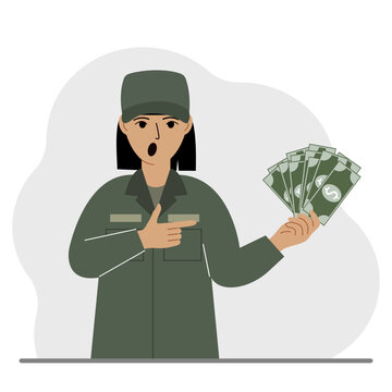 Military woman holds a lot of money in his hand. The concept of payment for military service or service in the army under a contract.