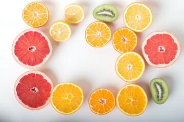 apple, grapefruit, pomegranate, orange, kiwi, tangerine, lemon on a white background.cut fruit. isolated. on a white background.