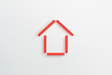 Red wooden house frame on white background. family home, real estate