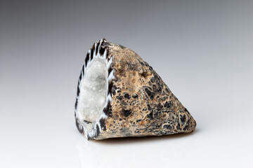 Agate Geode with Hyaline Quartz on Grey Background