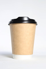 a disposable cup with a dark lid on a light background