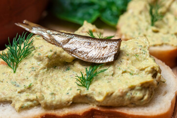Sandwich with fish pate and sprats.