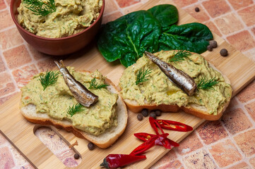 Sandwich with fish pate and sprats.