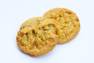 pistachio and almond cookies on white background.