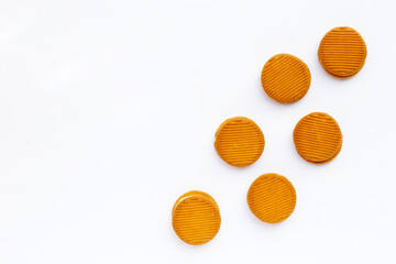 Custard cream sandwich biscuits on white background.