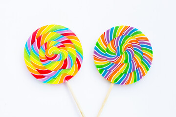 Rainbow lollipop on white background.
