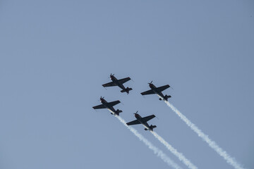 aerobatics on sports planes over the sea in the sky of Jordan