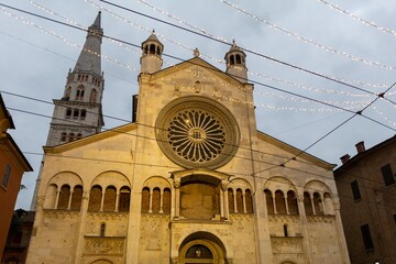 historic center of modena lit up at christmas with shop windows and shops decorated for christmas...