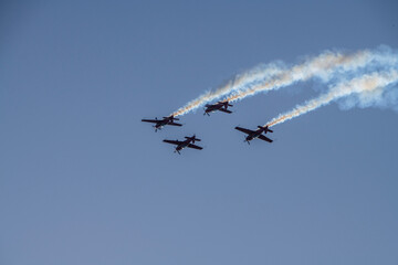 aerobatics on sports planes over the sea in the sky of Jordan
