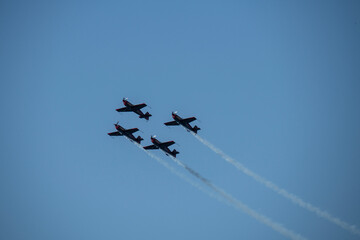 aerobatics on sports planes over the sea in the sky of Jordan