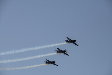 Fototapeta na wymiar aerobatics on sports planes over the sea in the sky of Jordan