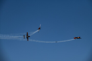 aerobatics on sports planes over the sea in the sky of Jordan