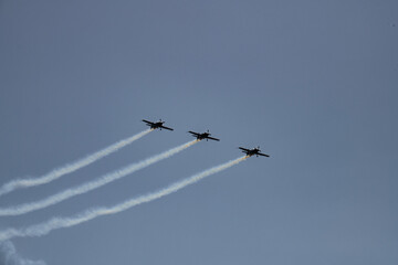 aerobatics on sports planes over the sea in the sky of Jordan