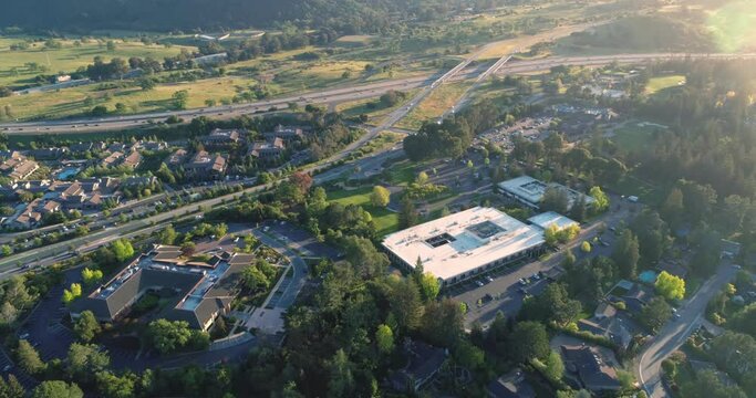 Aerial: Flying over Sandhill Road and the 280 Freeway, home of venture capital firms. Menlo Park, Silicon Valley. 