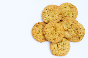 Pistachio and almond cookies on white background.
