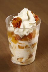 Ripe mango honeycomb candy dessert with whipped cream
