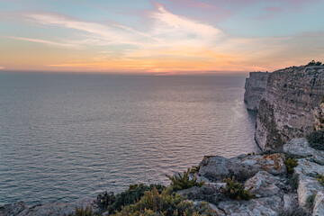Sunset over the sea and the beautiful cliffs.