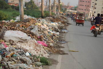 Heap of trush is the side of road