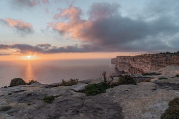 Sunset in Gozo with a view over the beautiful cliffs. 