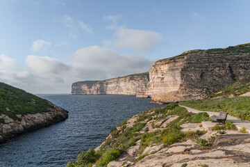 Fototapeta na wymiar Cliffs at Xlendi in Gozo. With views over the sea. 