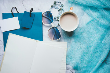 Flat lay for fashion blogger with a blank notebook and accessories