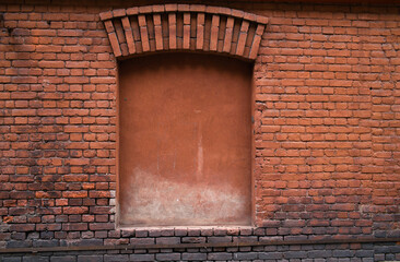 Blocked old window, brick wall. Vintage