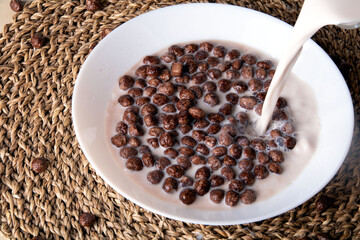 photo chocolate balls poured with milk on top