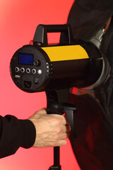 Fototapeta premium studio flash with softbox on tripod with back