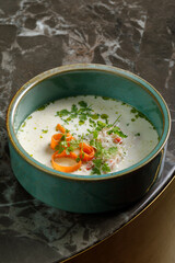 Soup with seafood served in restaurant. Copy space