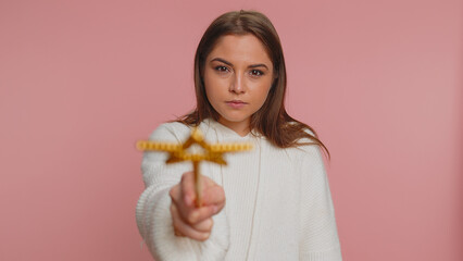 Magician witch woman gesturing with magic wand fairy stick, making wish come true, casting magician...