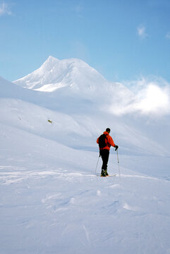 A male skier touring in the Italian Alps.