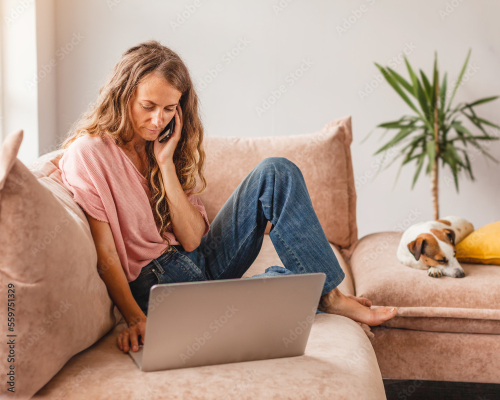 Poster Cheerful woman using silver laptop