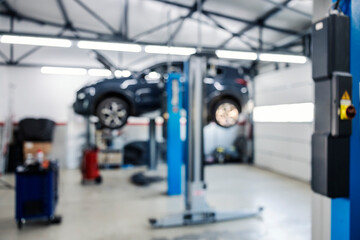 Blurred picture of a mechanic's shop interior.
