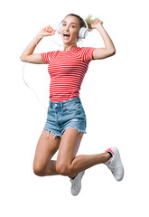 Cheerful woman listening to music and jumping