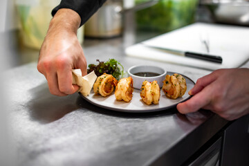 man chef cooking fried shrimp on kitchen