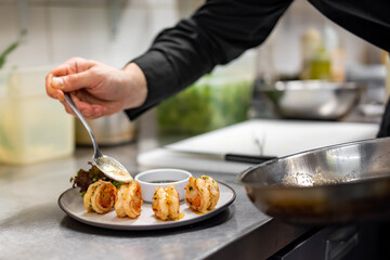 man chef cooking fried shrimp on kitchen