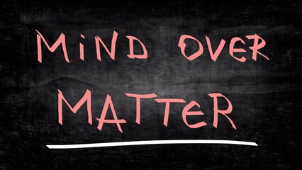 Mind over matter handwritten on blackboard