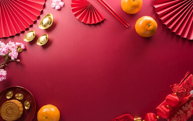 Chinese new year decorations made from red packet, orange and gold ingots or golden lump. Chinese characters on the object means to fortune, good luck, wealth, and money flow.