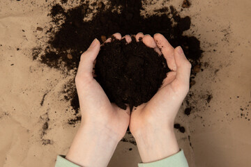 Soil in hands. National soil day. Earth day concept.