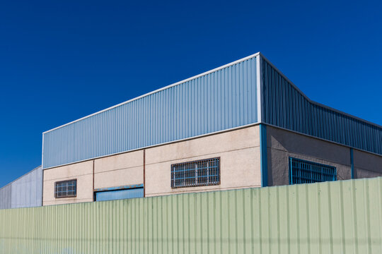 Storage Building With Concrete Walls And Sheet Metal Roof As Seen From Outside