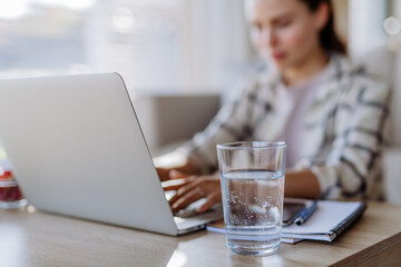 Young woman having homeoffice in her apartment.